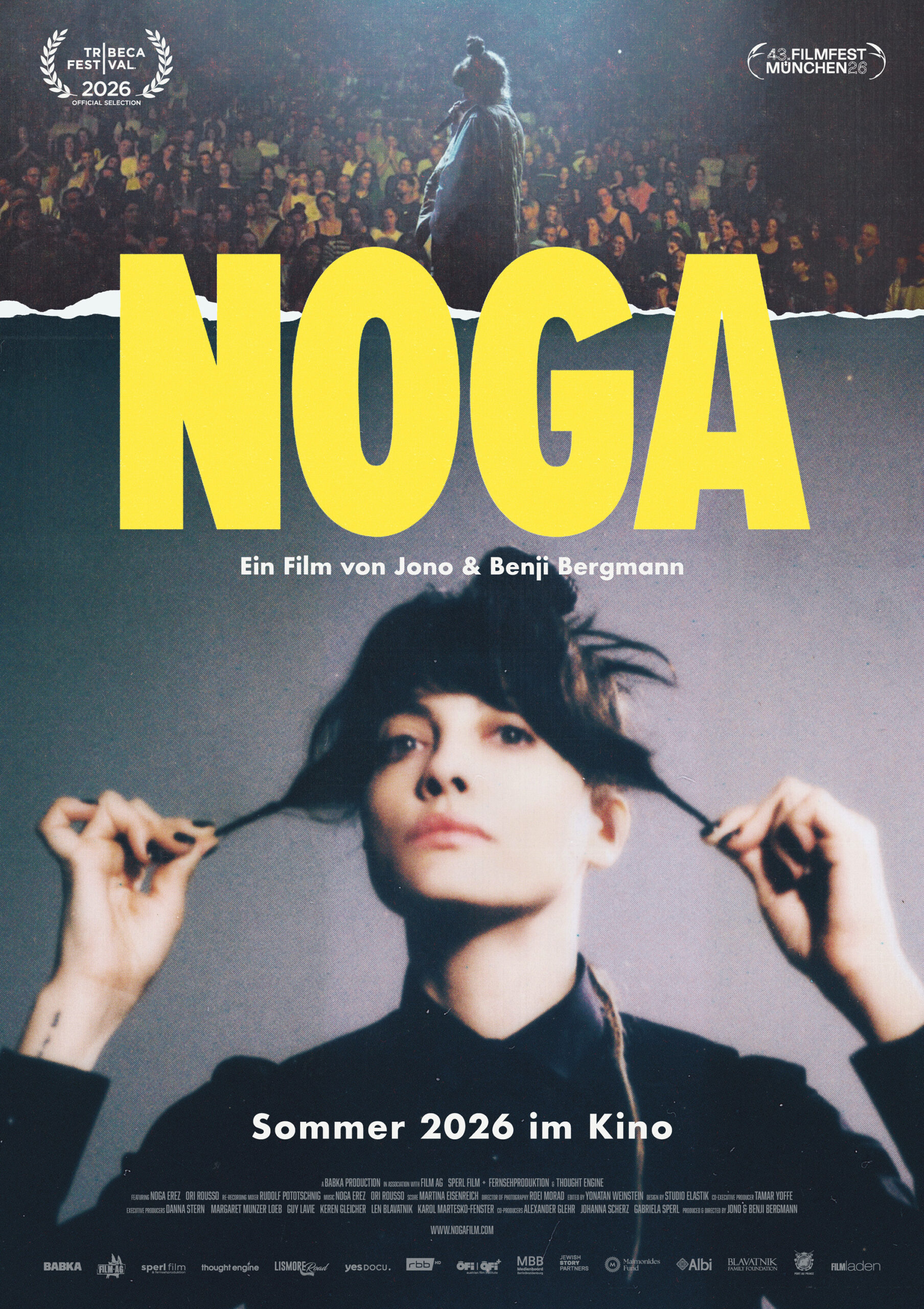 Filmplakat zu NOGA mit großer gelber Titelzeile, Sängerin im Vordergrund und Bühnenpublikum im Hintergrund